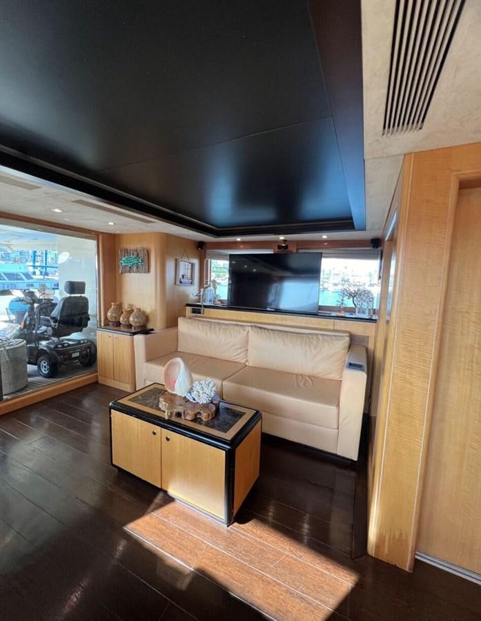 a living room with a couch and a coffee table aboard WHISPER Yacht for Sale
