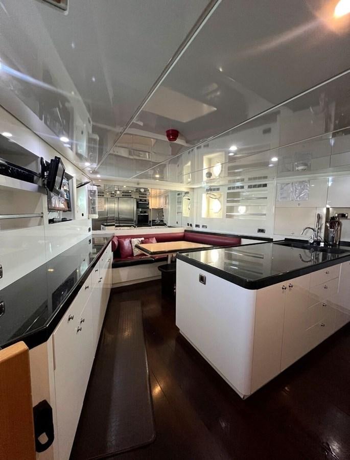 a large kitchen with a large glass wall aboard WHISPER Yacht for Sale
