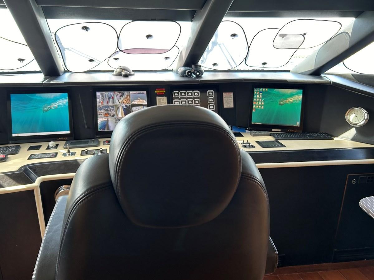 a room with computers and monitors aboard WHISPER Yacht for Sale