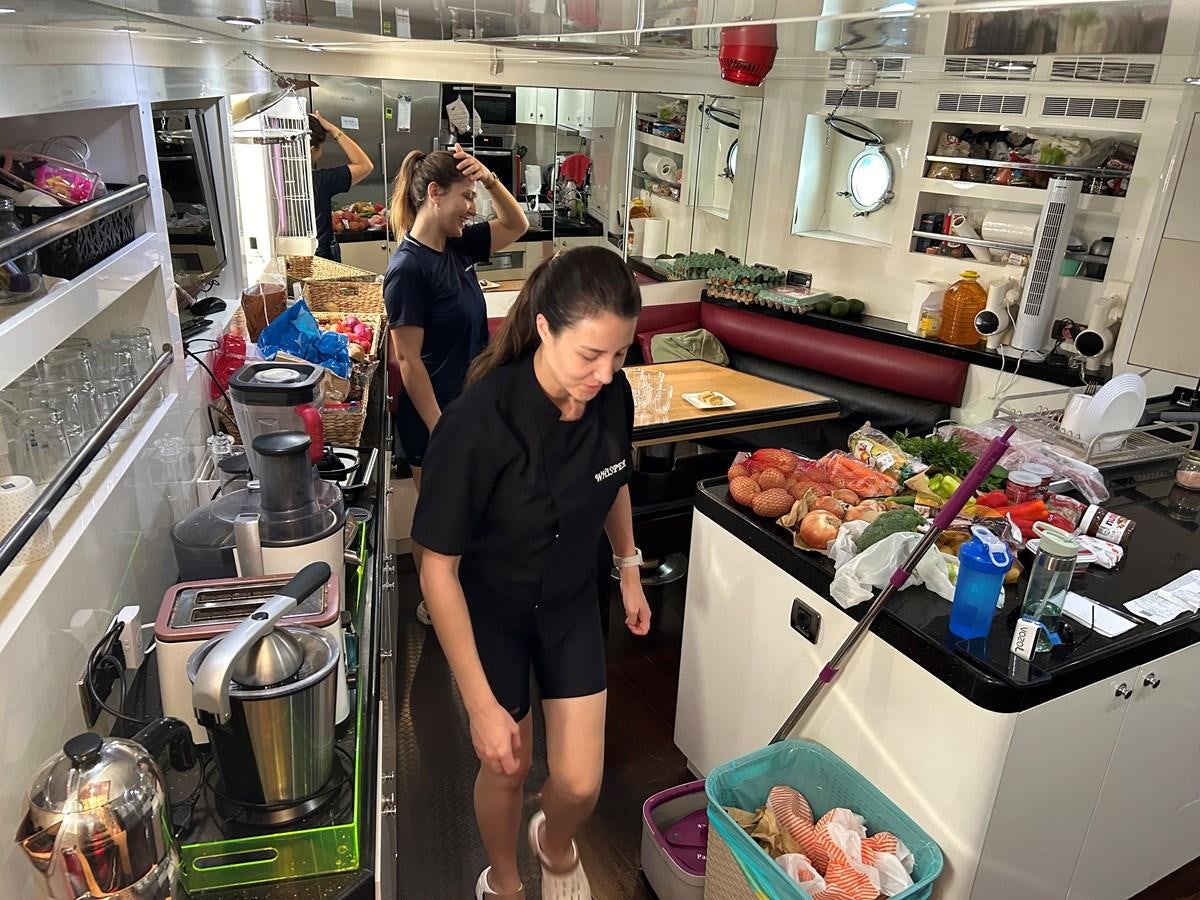 a group of women in a kitchen aboard WHISPER Yacht for Sale