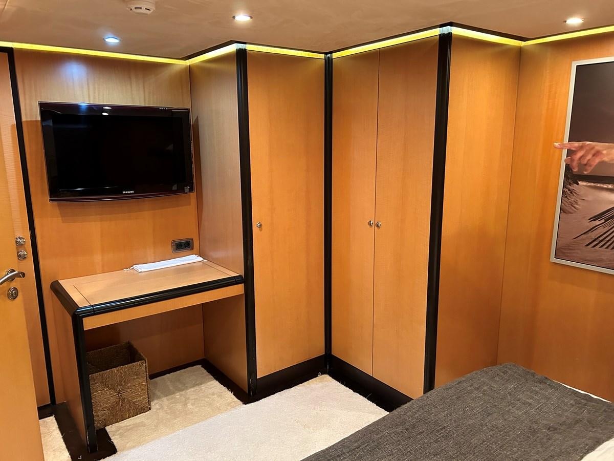 a room with a tv and a bed aboard WHISPER Yacht for Sale