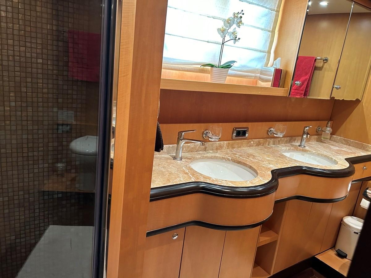 a bathroom with a sink and a shower aboard WHISPER Yacht for Sale
