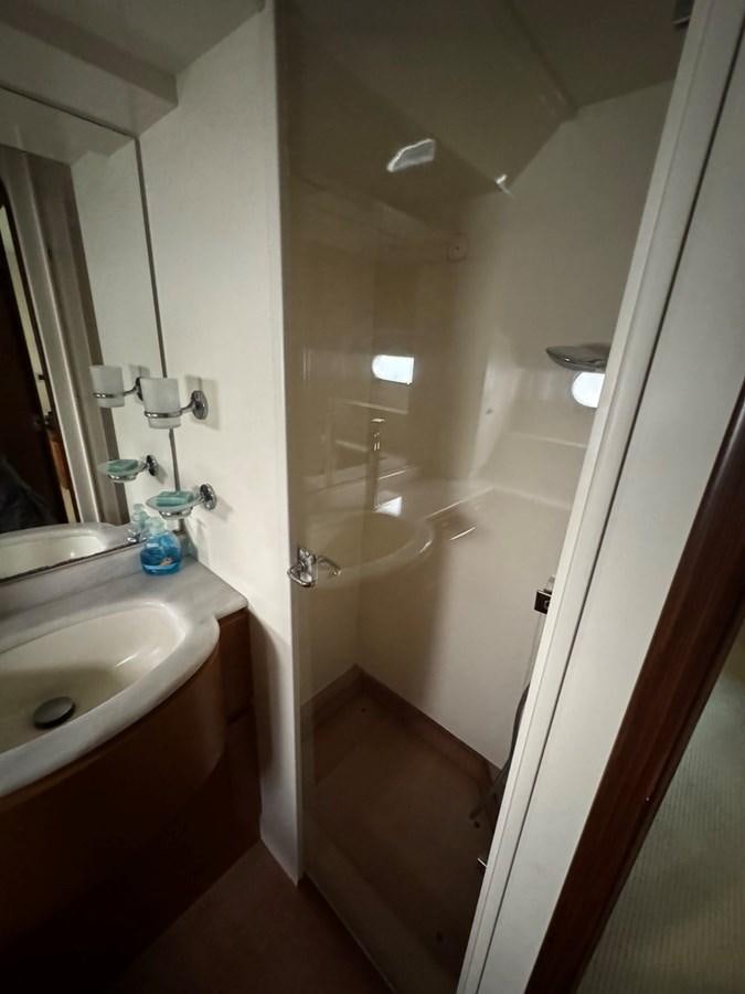 a bathroom with a glass shower aboard WHISPER Yacht for Sale