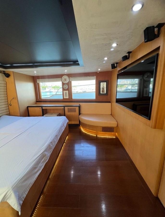 a room with a bed and a bench aboard WHISPER Yacht for Sale