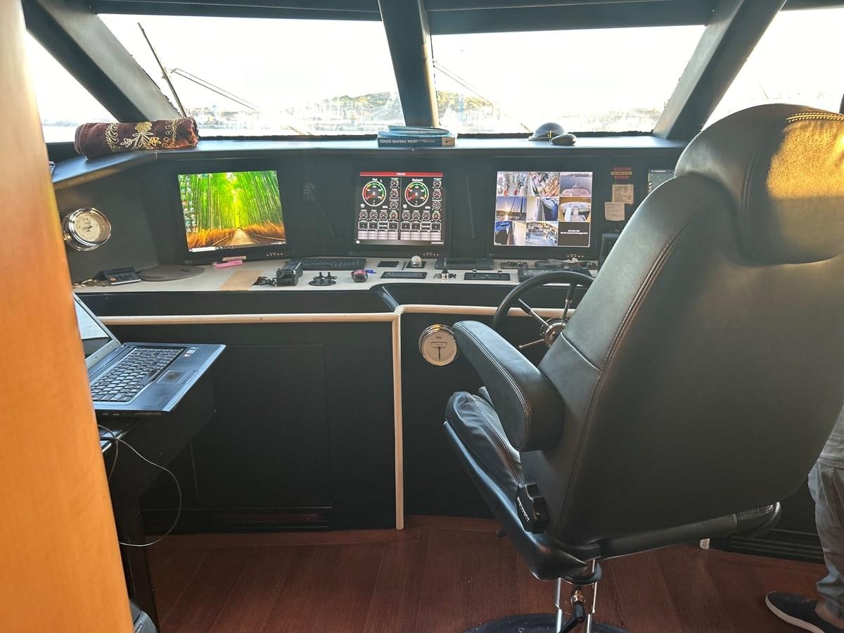 a leather chair in front of a computer desk aboard WHISPER Yacht for Sale