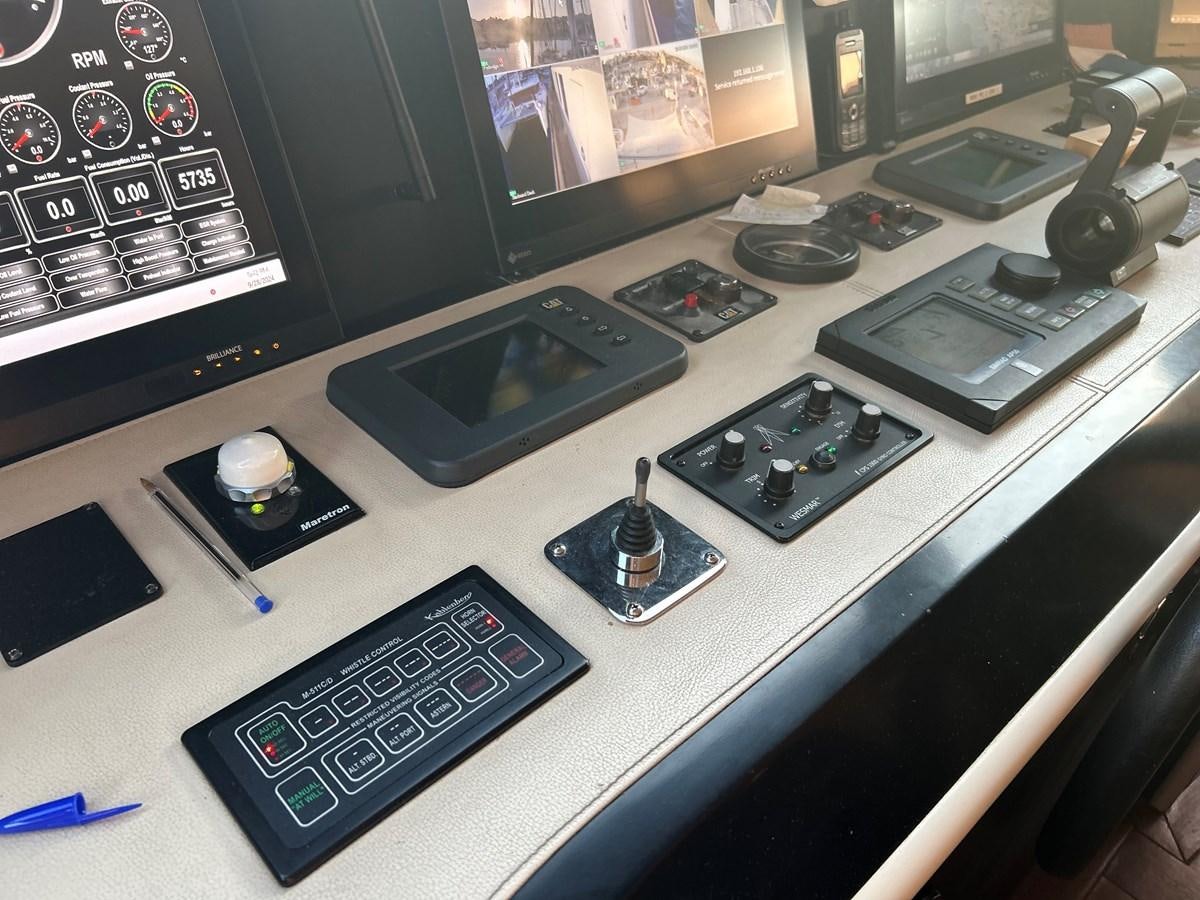 a desk with a computer and other electronic devices on it aboard WHISPER Yacht for Sale