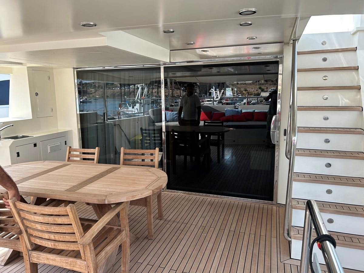 a room with a table and chairs aboard WHISPER Yacht for Sale