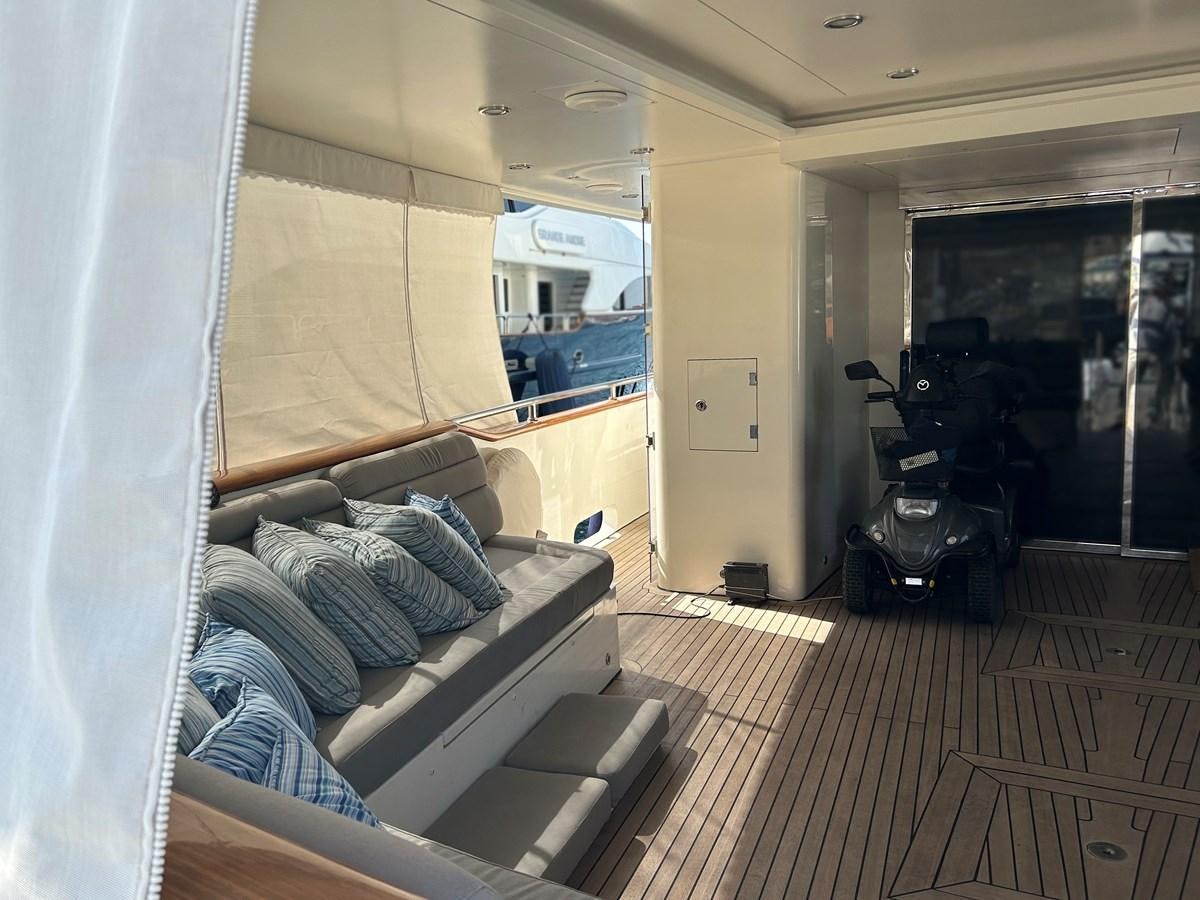 a person lying on a couch aboard WHISPER Yacht for Sale