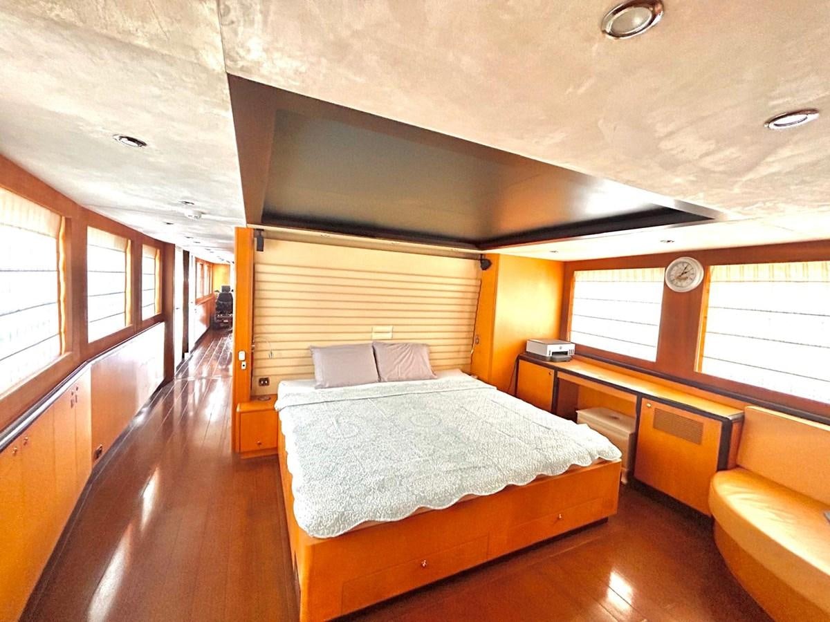 a room with a bed and a desk aboard WHISPER Yacht for Sale