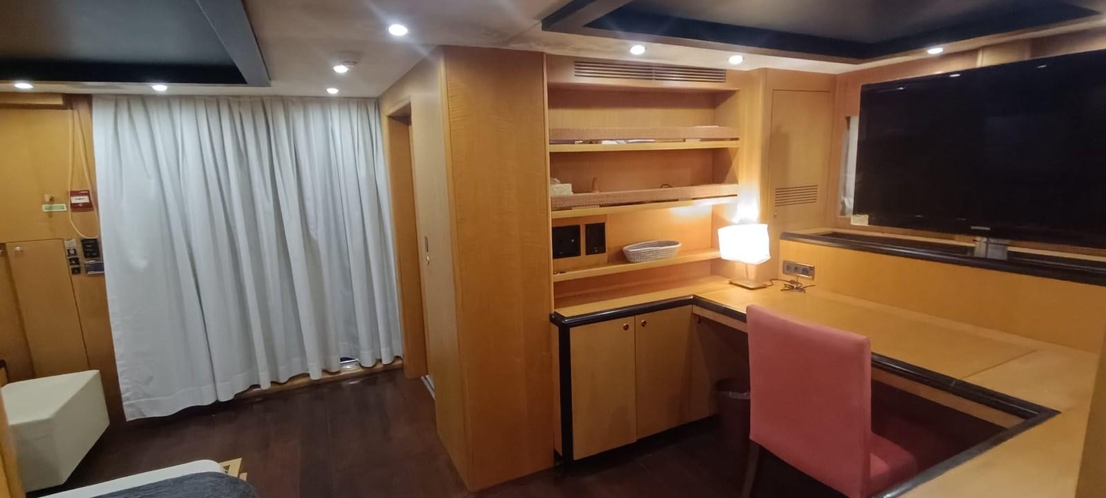 a room with a desk and a tv aboard WHISPER Yacht for Sale