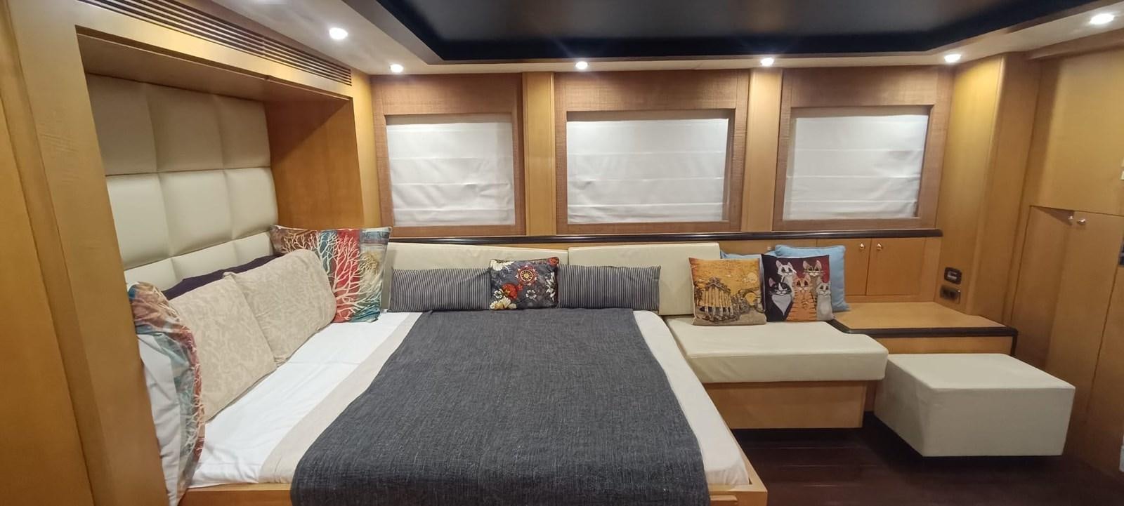 a room with a bed and a window aboard WHISPER Yacht for Sale