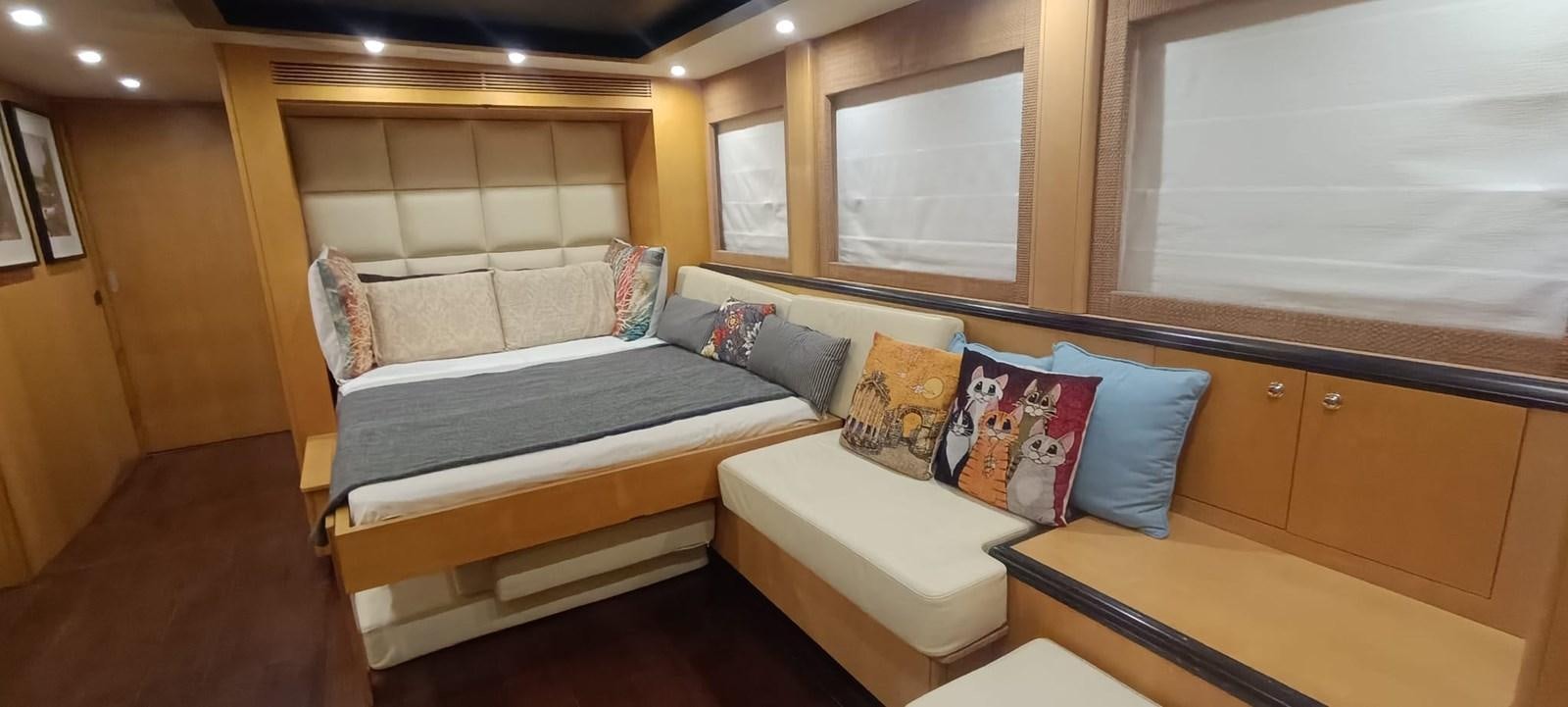 a room with a bed and a couch aboard WHISPER Yacht for Sale