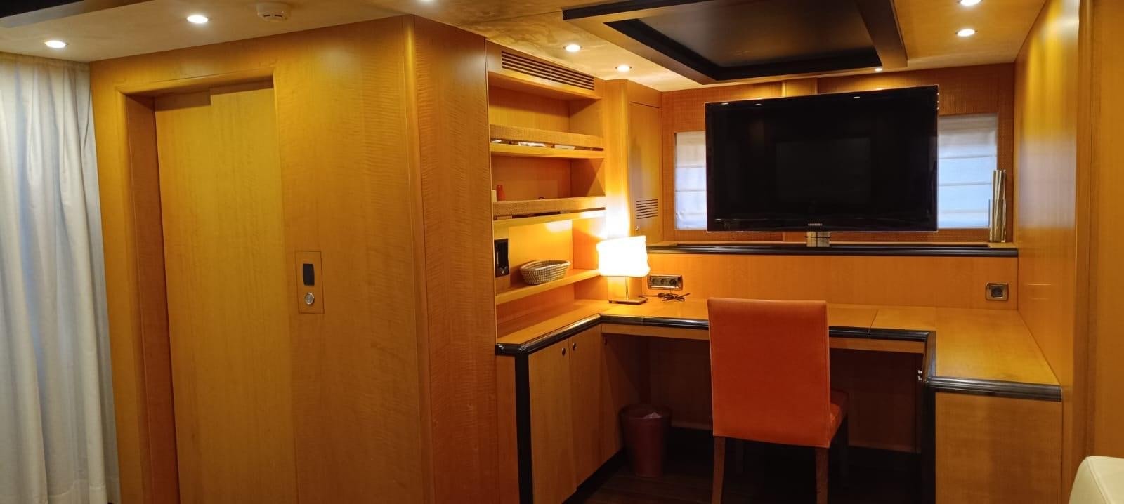 a room with a tv and a chair aboard WHISPER Yacht for Sale
