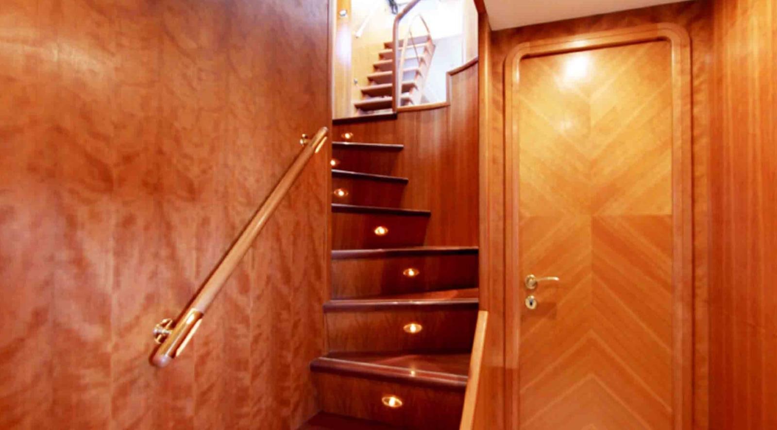a wooden door with a handle aboard COUACH 3000 FLY Yacht for Sale