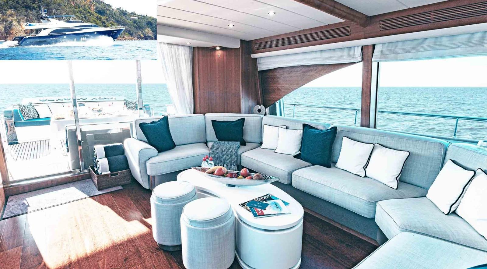 a living room with a large patio aboard COUACH 3000 FLY Yacht for Sale