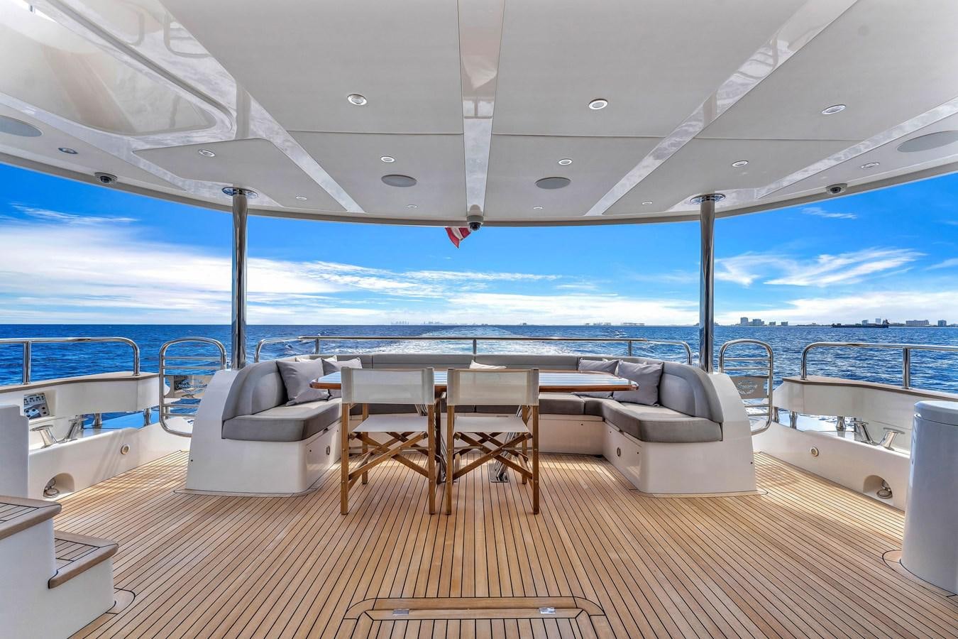 a deck with a table and chairs on it aboard 2018 SUNSEEKER 95 YACHT Yacht for Sale