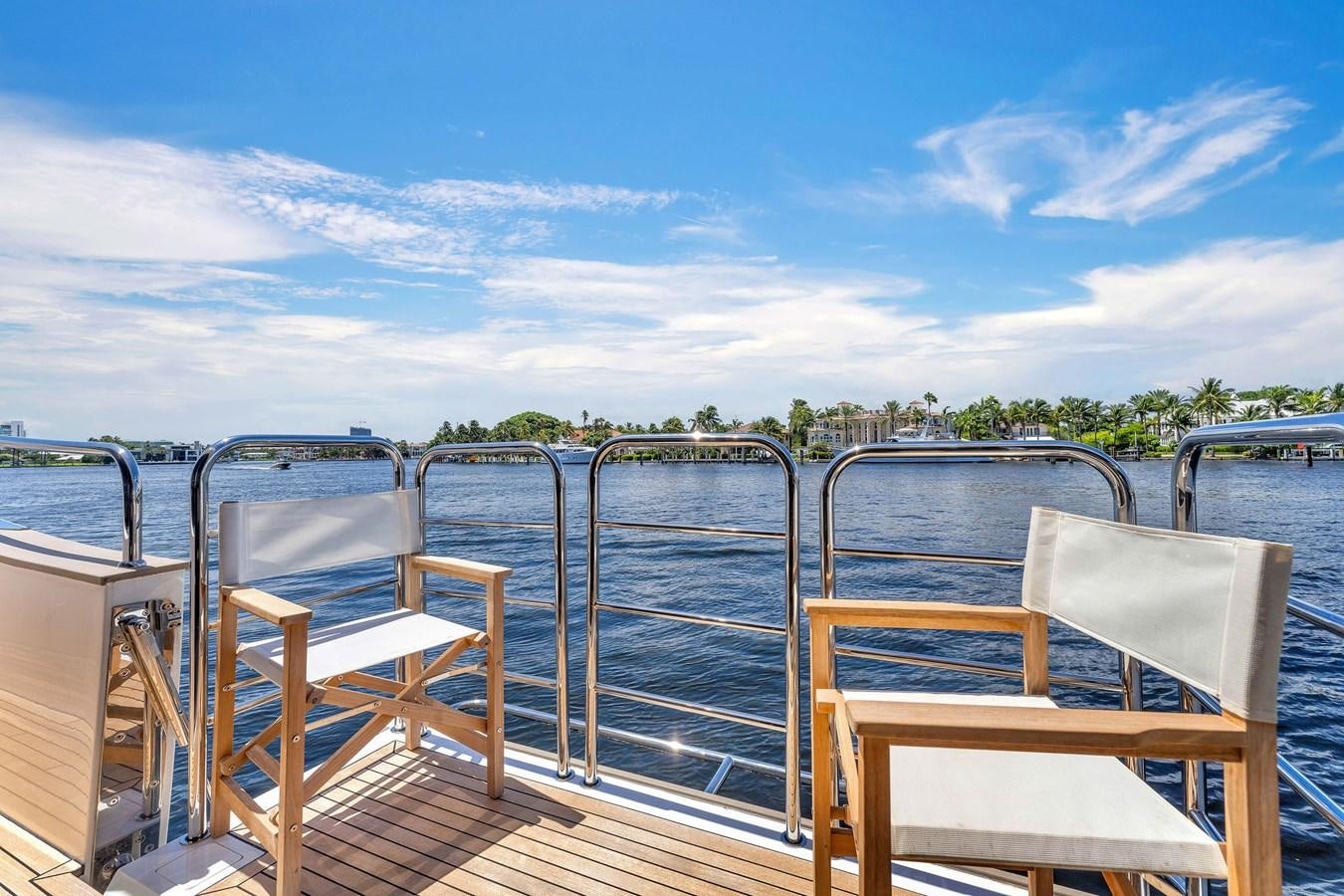 a deck with chairs and a body of water aboard 2018 SUNSEEKER 95 YACHT Yacht for Sale