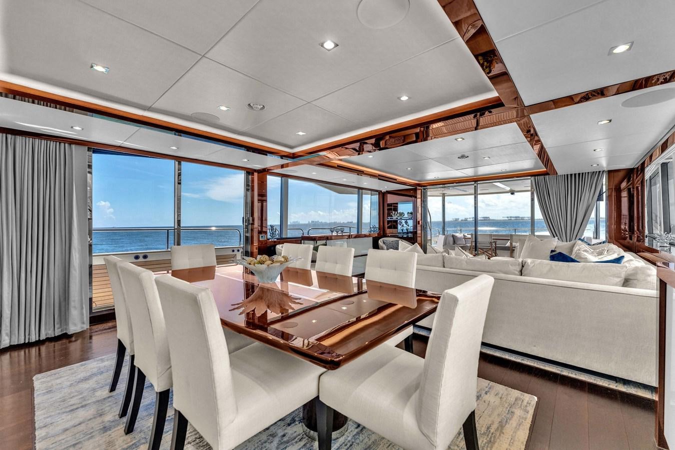 a room with a table chairs and a large window aboard 2018 SUNSEEKER 95 YACHT Yacht for Sale