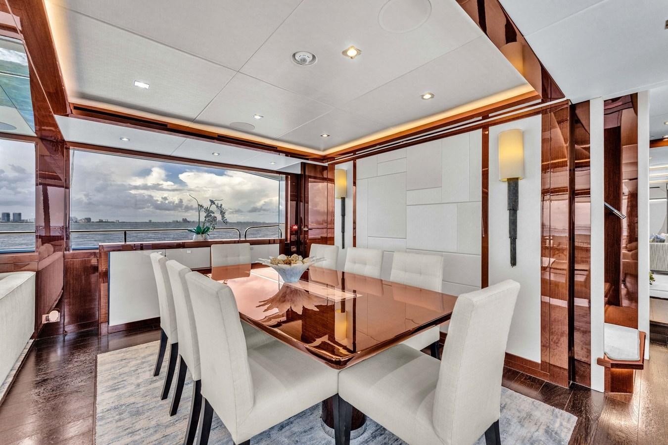 a dining room with a large window aboard 2018 SUNSEEKER 95 YACHT Yacht for Sale