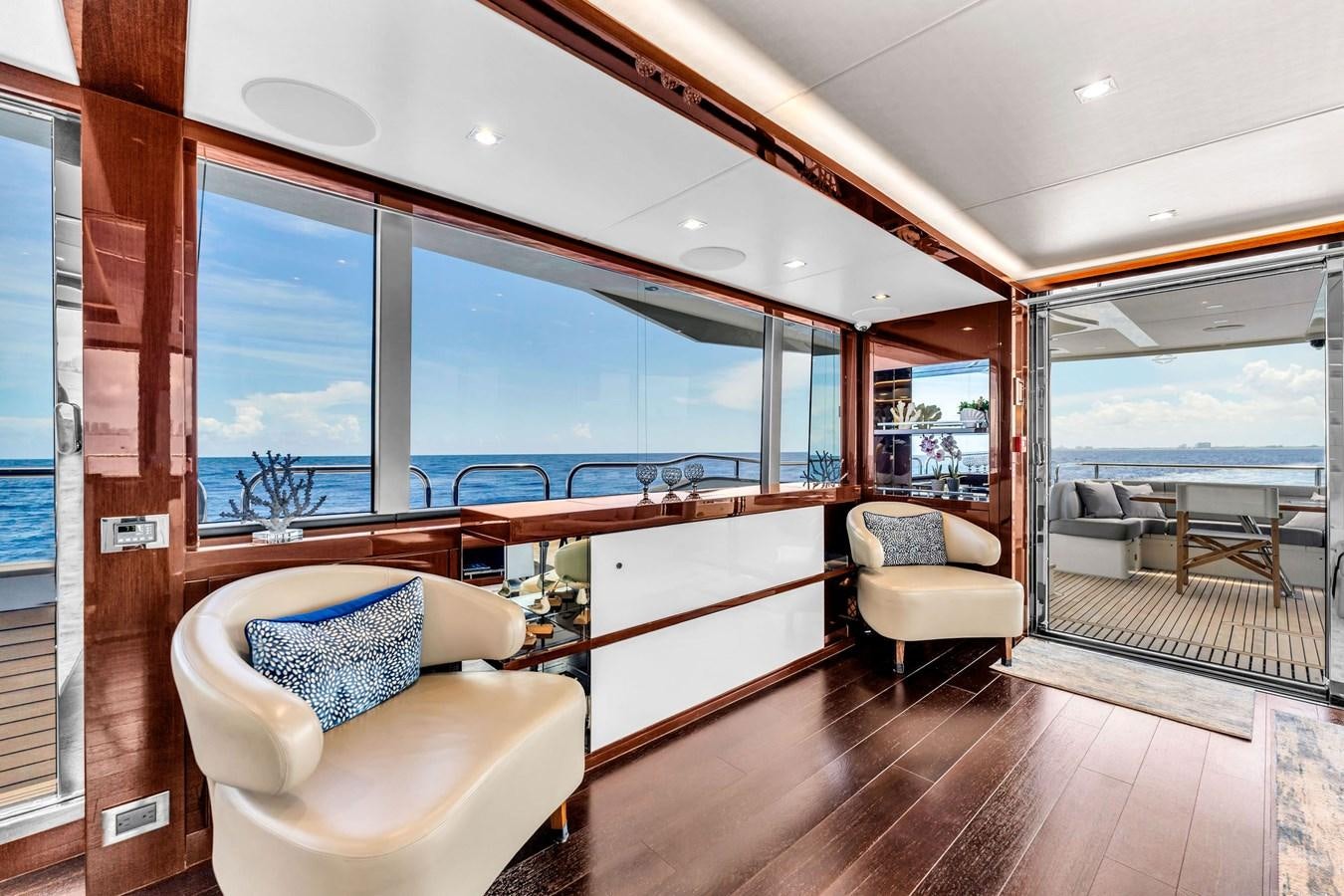 a room with a view of the ocean and the deck aboard 2018 SUNSEEKER 95 YACHT Yacht for Sale