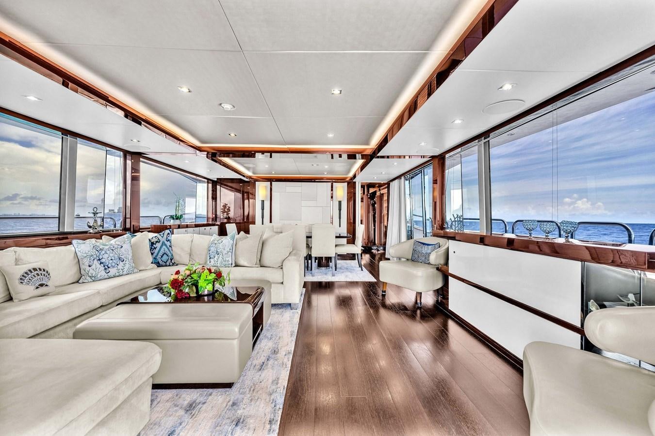 a living room with a large window aboard 2018 SUNSEEKER 95 YACHT Yacht for Sale