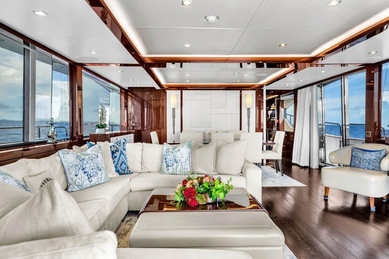 a living room with a couch and a table aboard 2018 SUNSEEKER 95 YACHT Yacht for Sale