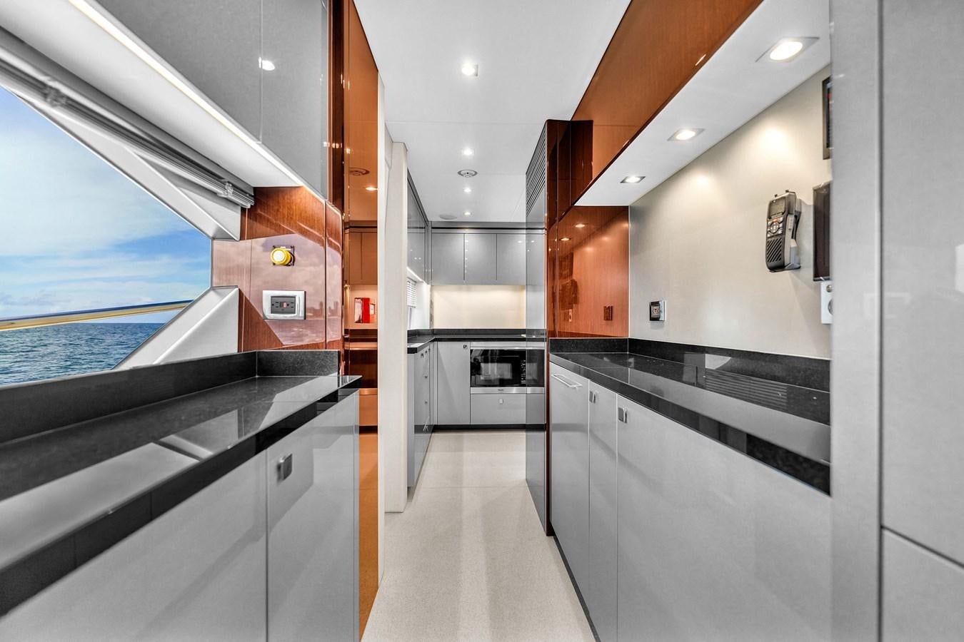 a room with a large window and a view of the water aboard 2018 SUNSEEKER 95 YACHT Yacht for Sale