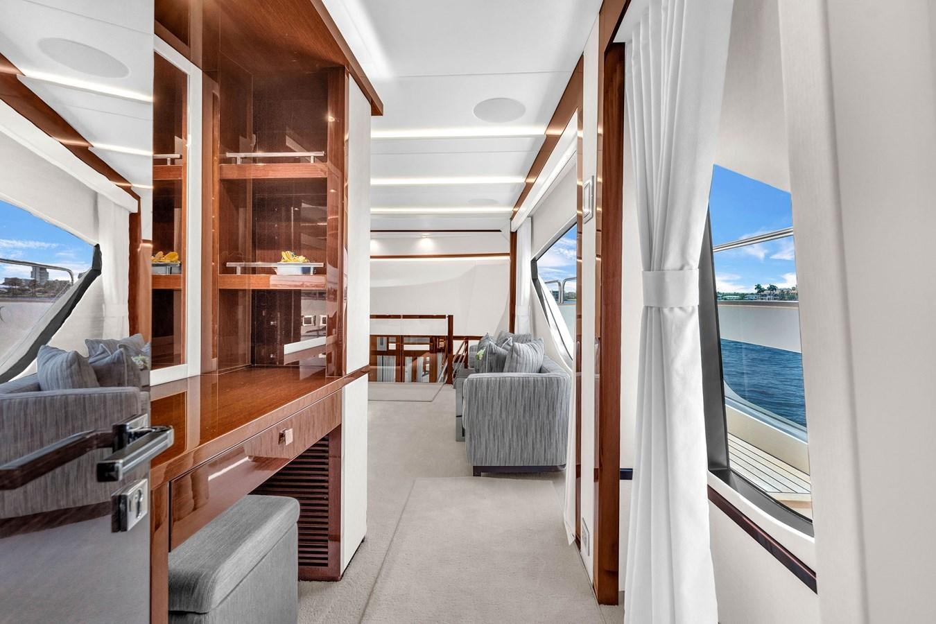 a room with a bed and a wood staircase aboard 2018 SUNSEEKER 95 YACHT Yacht for Sale