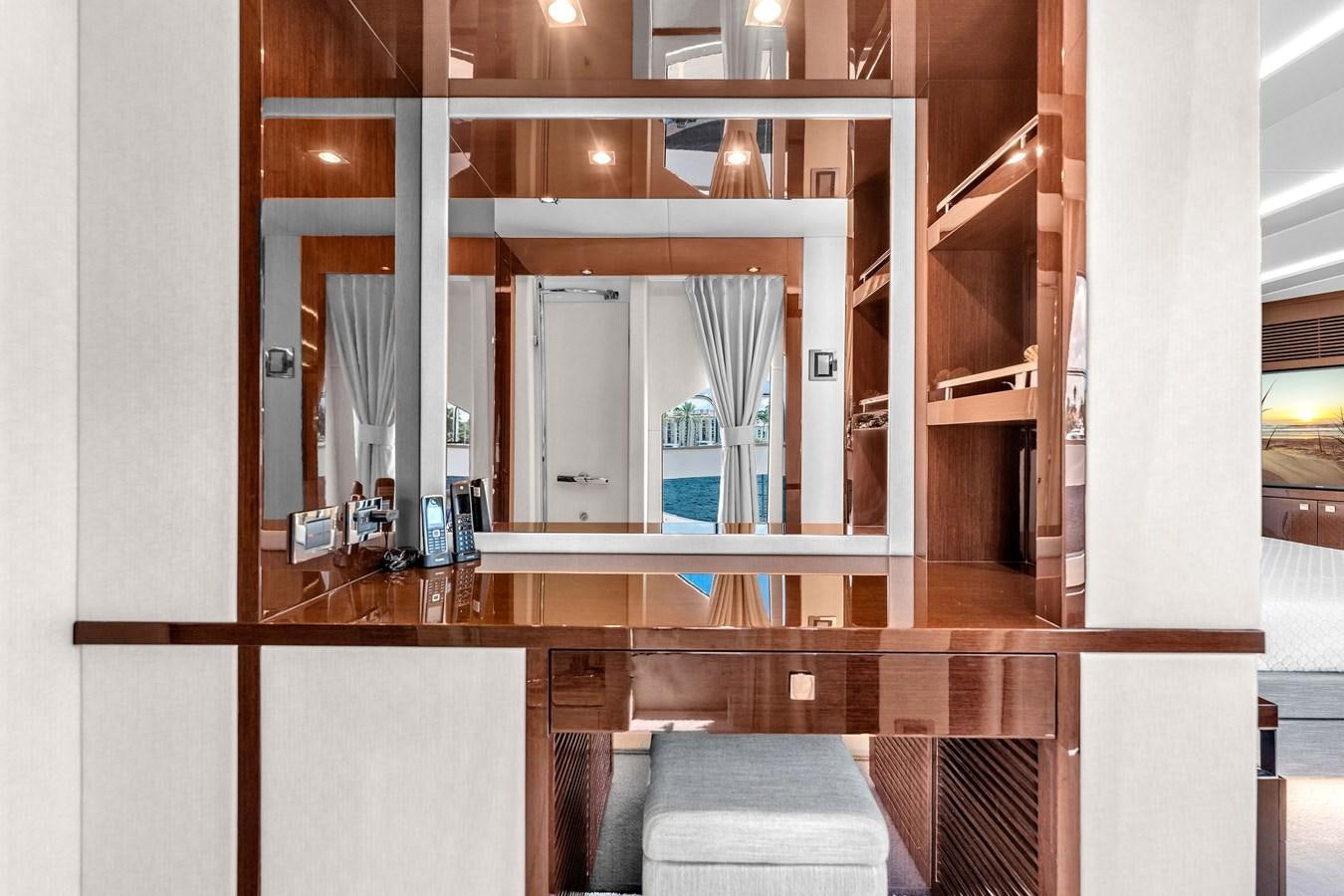 a room with a mirror and a bed aboard 2018 SUNSEEKER 95 YACHT Yacht for Sale