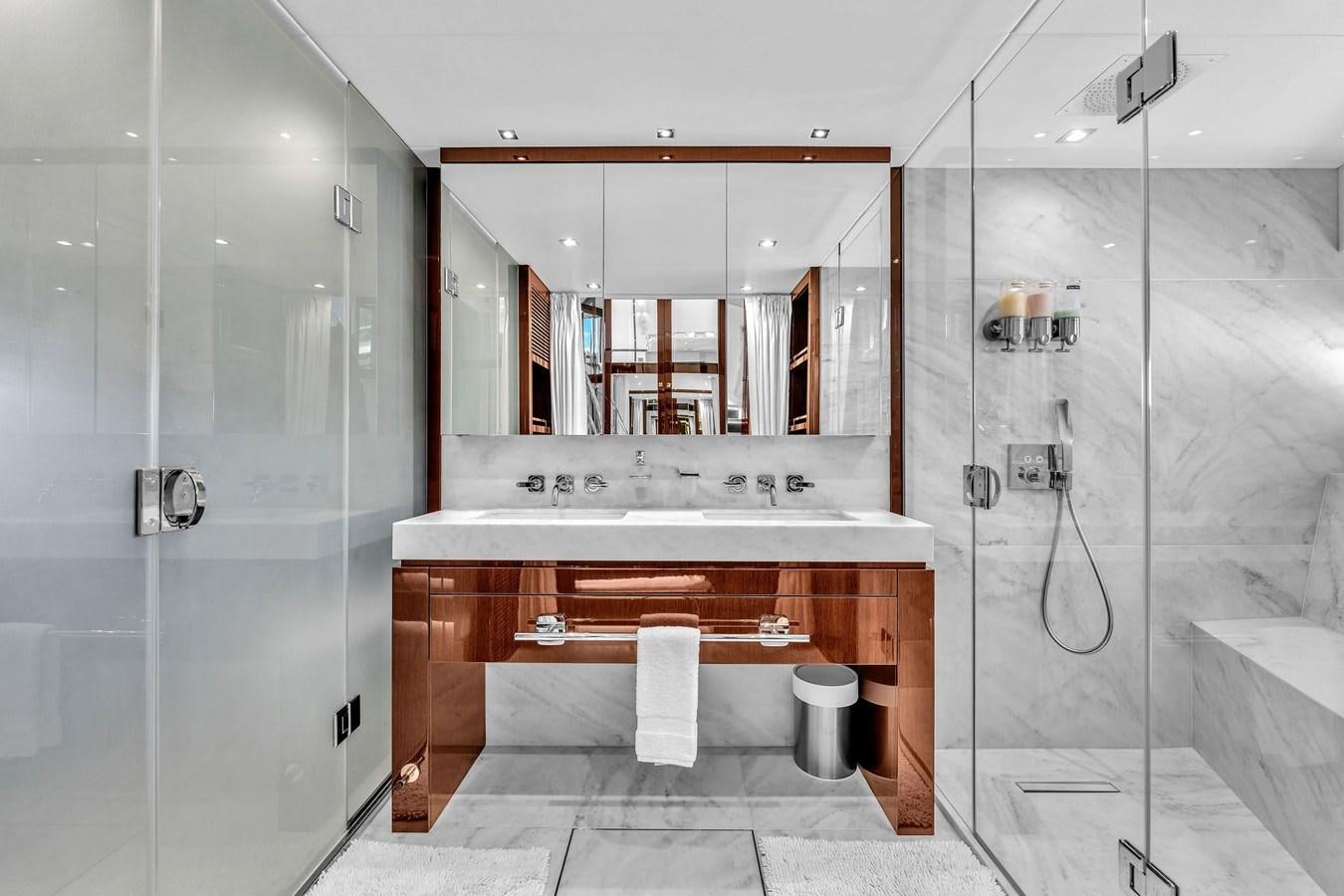 a bathroom with a large mirror aboard 2018 SUNSEEKER 95 YACHT Yacht for Sale