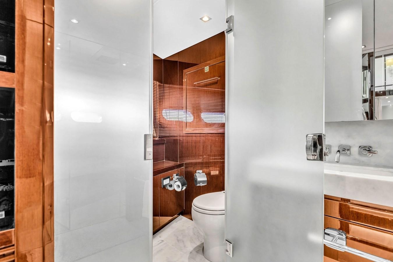 a bathroom with a toilet and a sink aboard 2018 SUNSEEKER 95 YACHT Yacht for Sale