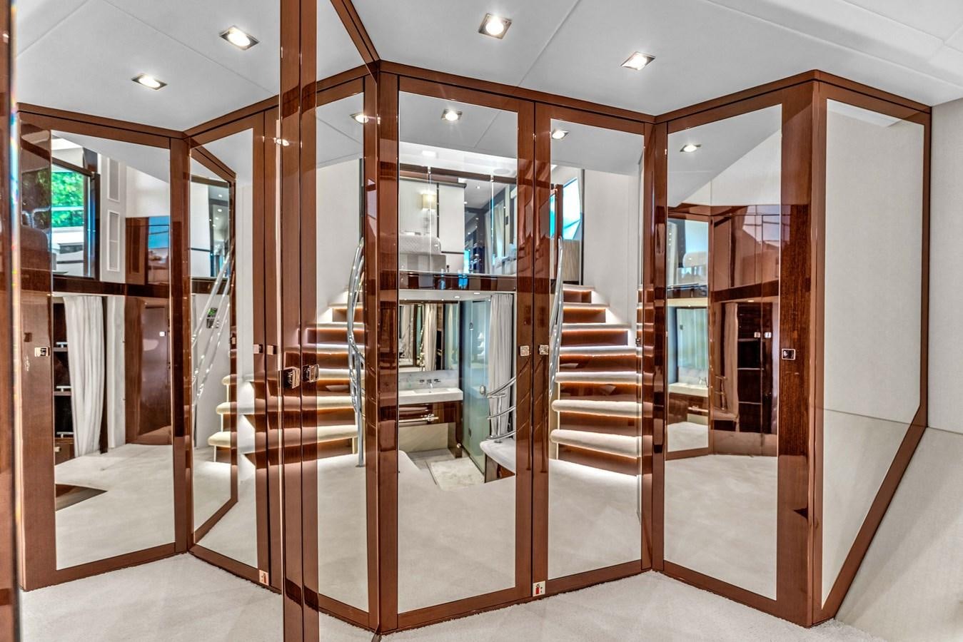 a room with glass doors aboard 2018 SUNSEEKER 95 YACHT Yacht for Sale