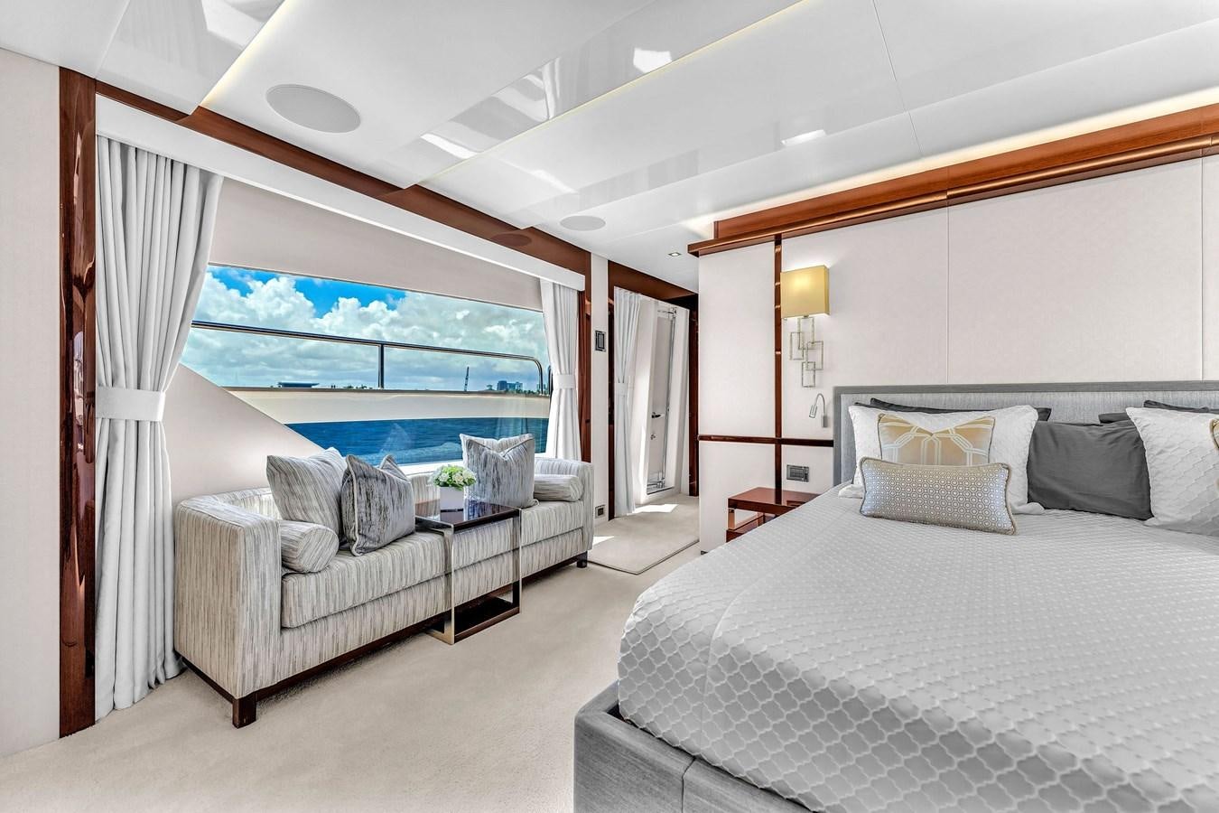 a room with a bed and a large window aboard 2018 SUNSEEKER 95 YACHT Yacht for Sale