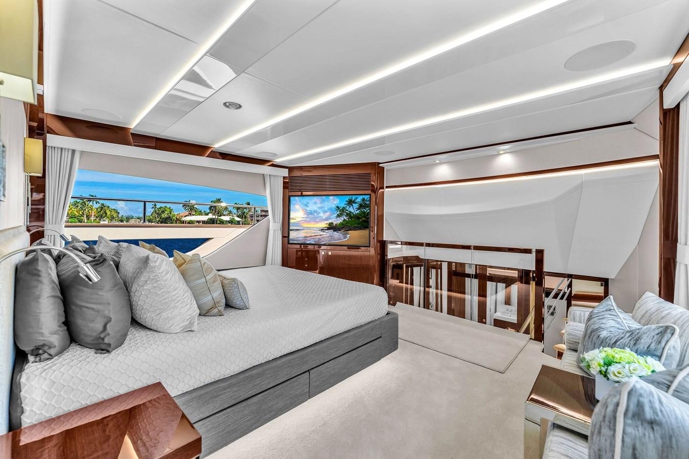 a room with a bed and a balcony aboard 2018 SUNSEEKER 95 YACHT Yacht for Sale