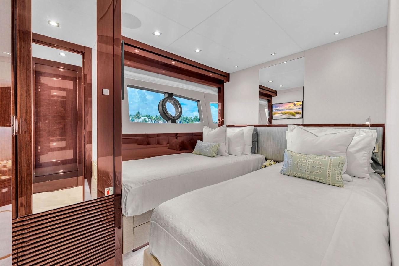 a room with a bed and a window aboard 2018 SUNSEEKER 95 YACHT Yacht for Sale