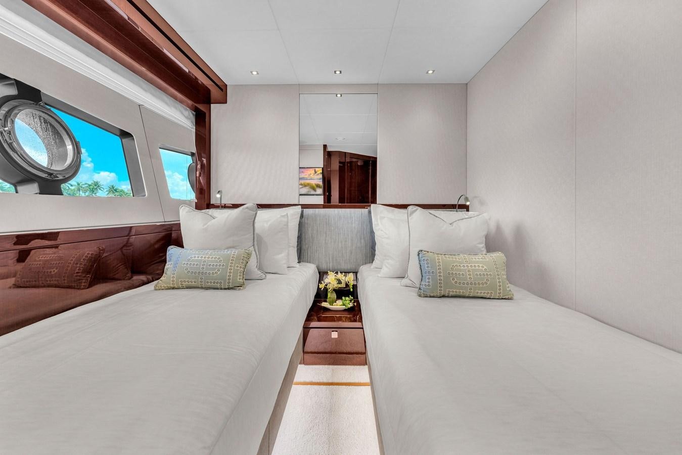 a room with a bed and a mirror aboard 2018 SUNSEEKER 95 YACHT Yacht for Sale