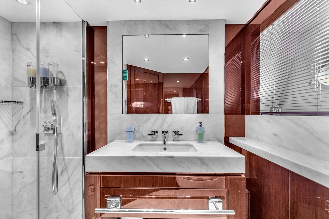 a bathroom with a large mirror aboard 2018 SUNSEEKER 95 YACHT Yacht for Sale