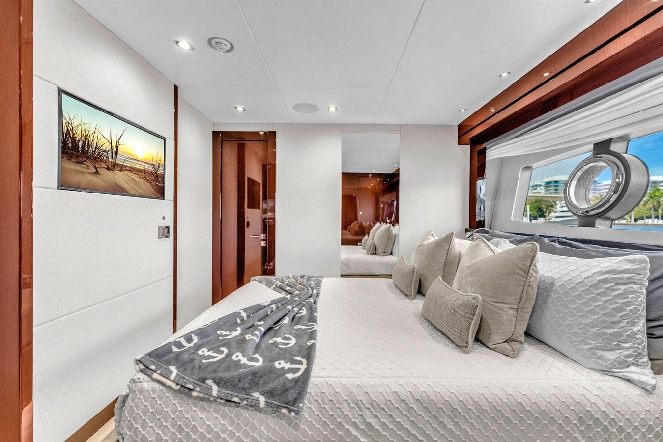 a bed with white sheets aboard 2018 SUNSEEKER 95 YACHT Yacht for Sale