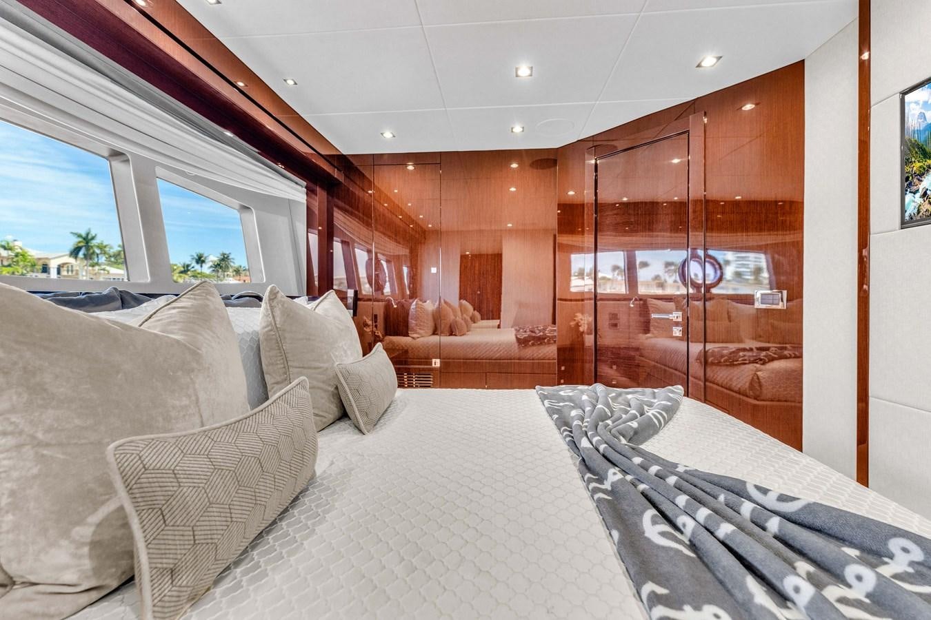 a large room with a bed and a large window aboard 2018 SUNSEEKER 95 YACHT Yacht for Sale