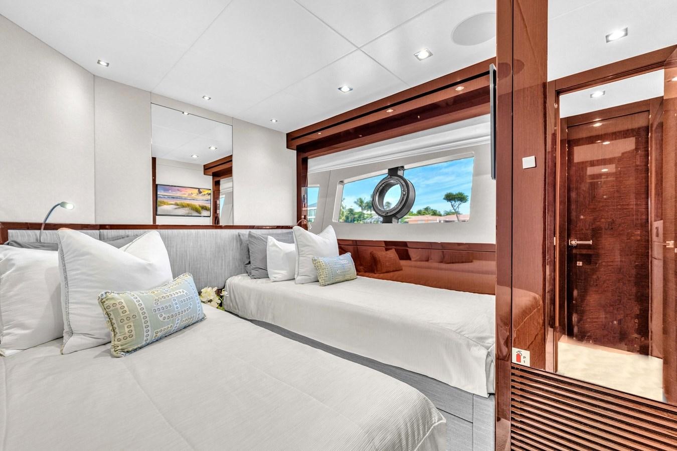 a room with a bed and a mirror aboard 2018 SUNSEEKER 95 YACHT Yacht for Sale