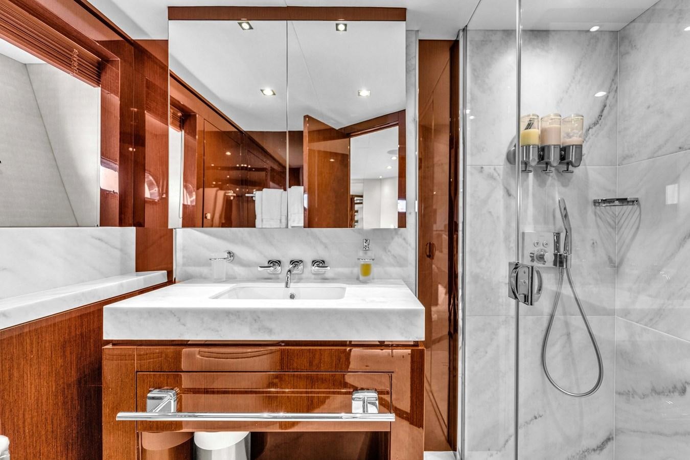 a bathroom with a sink and a mirror aboard 2018 SUNSEEKER 95 YACHT Yacht for Sale
