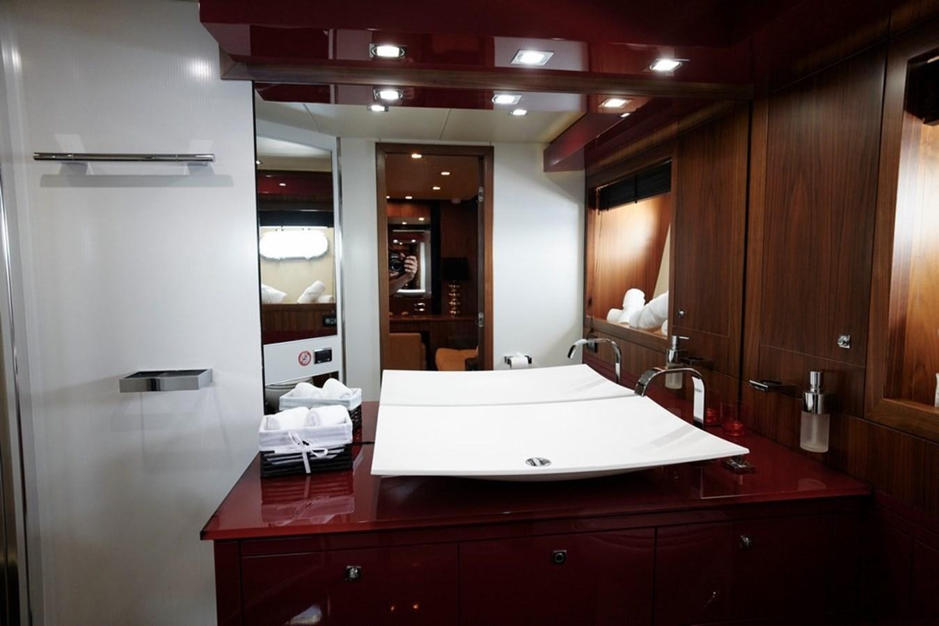 a bathroom with a large mirror aboard SUNSEEKER PREDATOR 92 Yacht for Sale