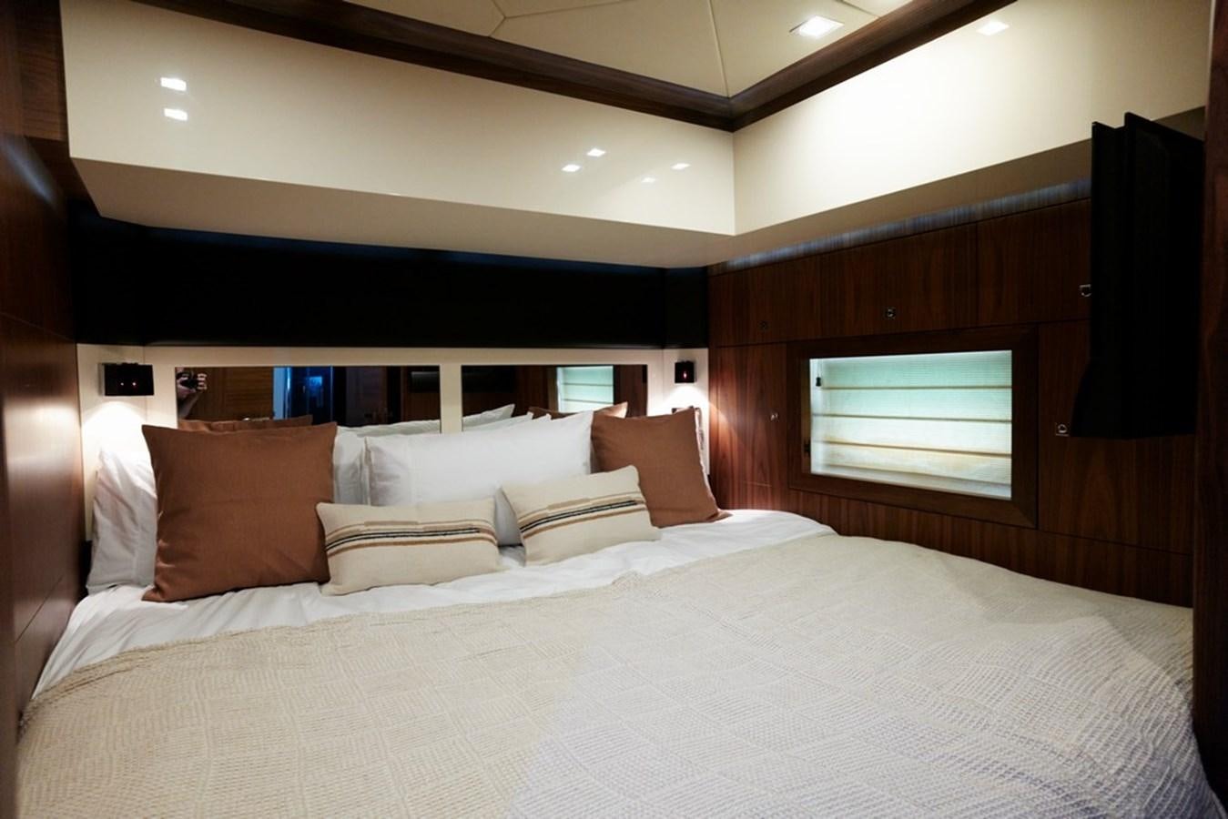 a bed with pillows aboard SUNSEEKER PREDATOR 92 Yacht for Sale