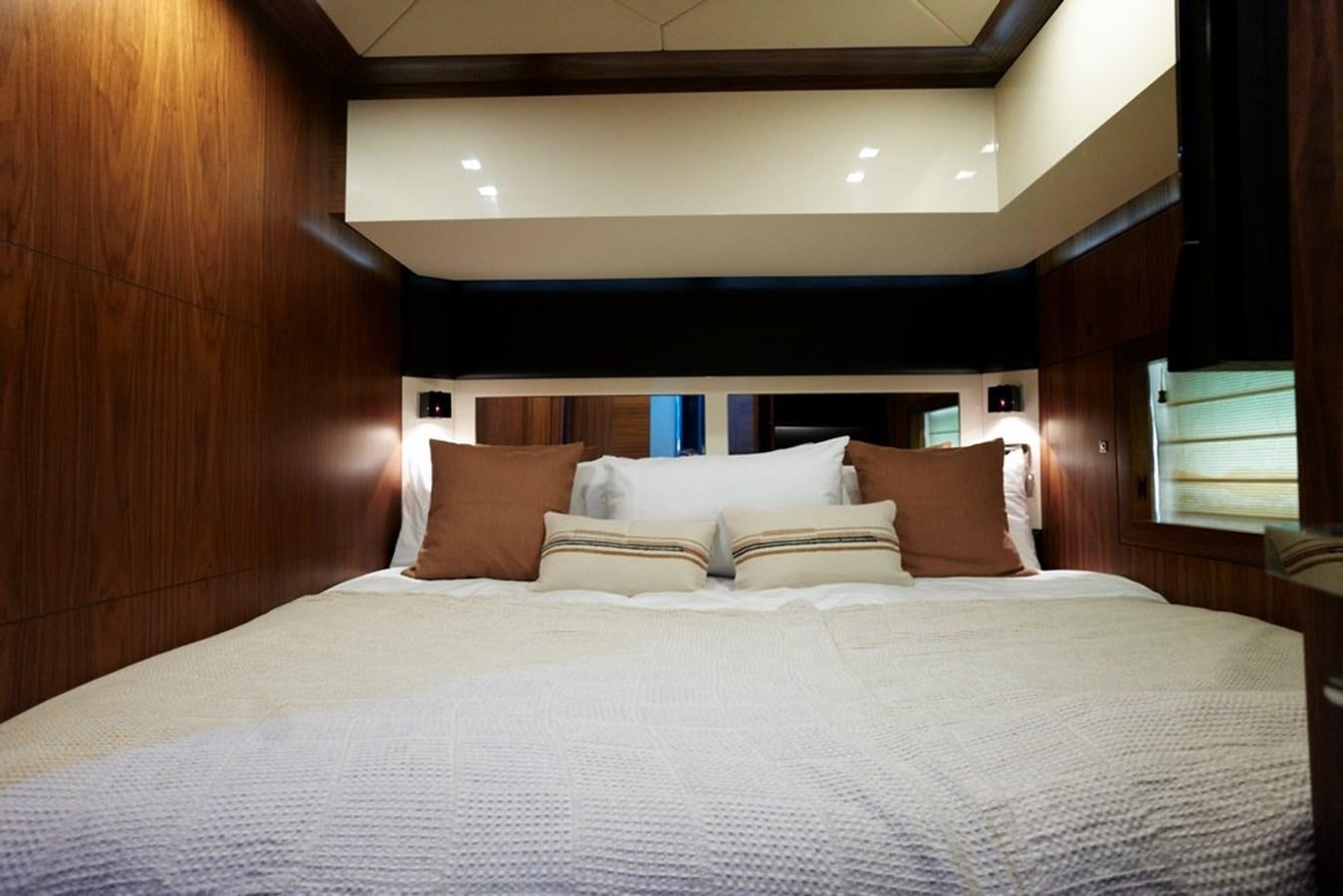 a bed with pillows aboard SUNSEEKER PREDATOR 92 Yacht for Sale