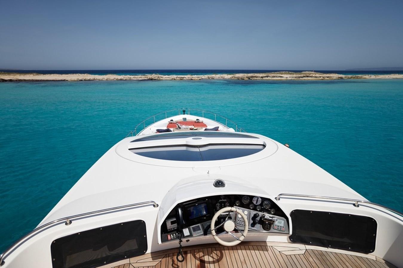 a white yacht on a dock aboard SUNSEEKER PREDATOR 92 Yacht for Sale