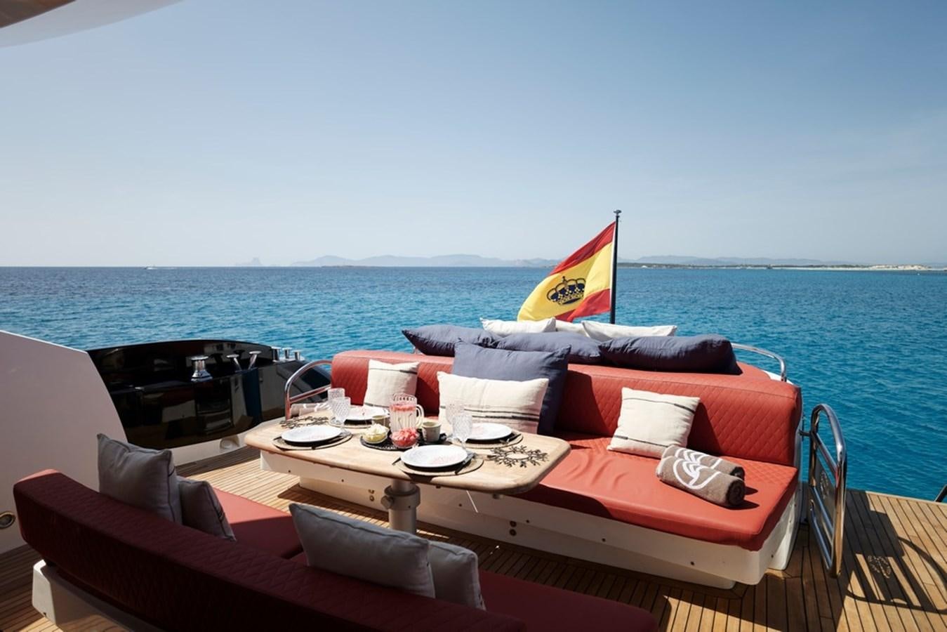 a table with a flag on it aboard SUNSEEKER PREDATOR 92 Yacht for Sale
