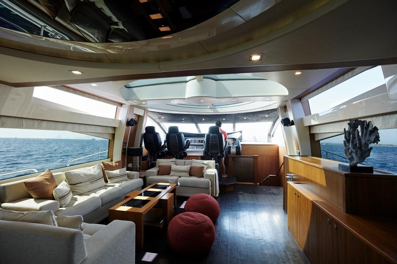 a room with a boat and a table and chairs aboard SUNSEEKER PREDATOR 92 Yacht for Sale