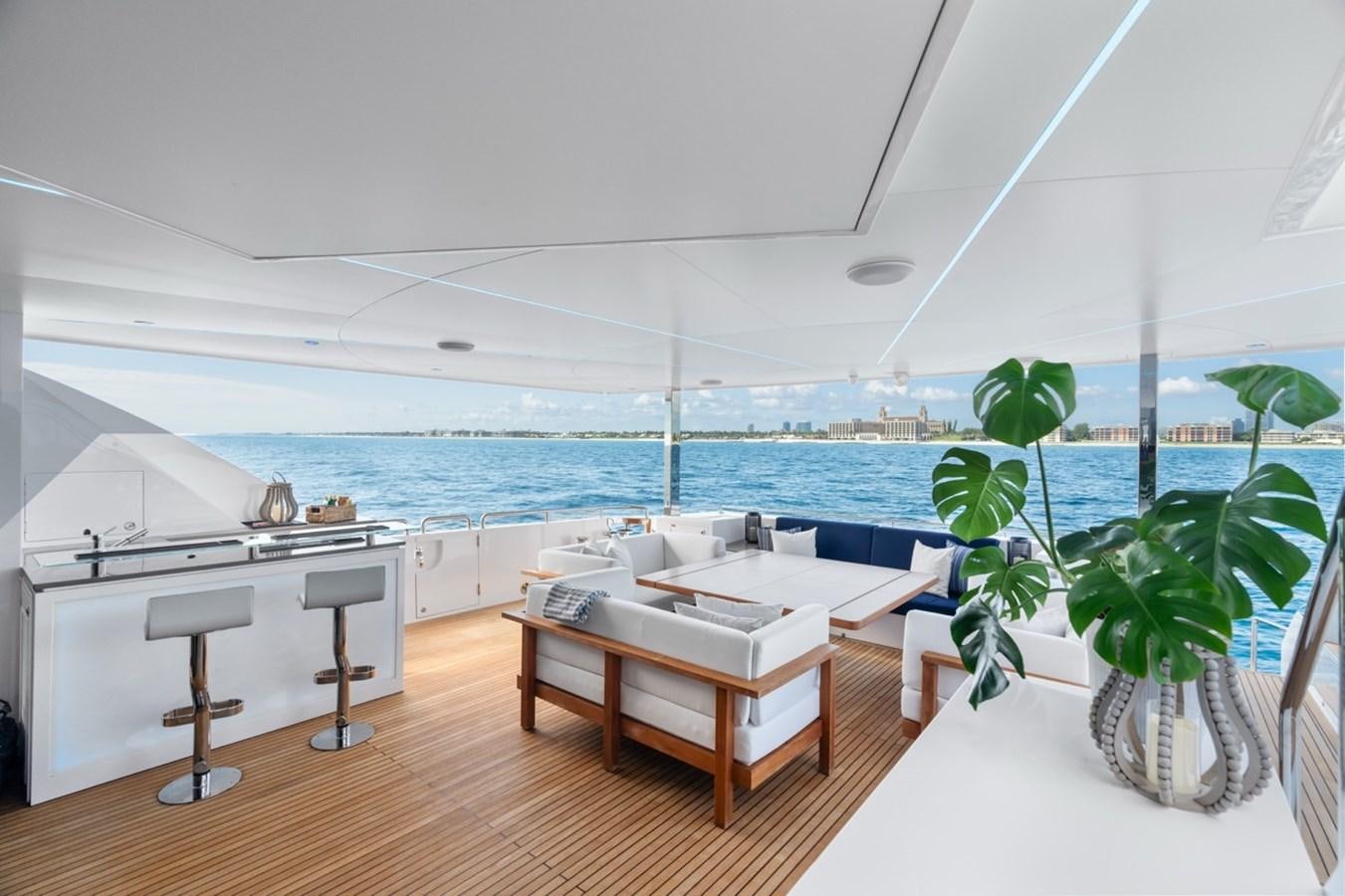 a room with a table and chairs aboard JEMILY II Yacht for Sale