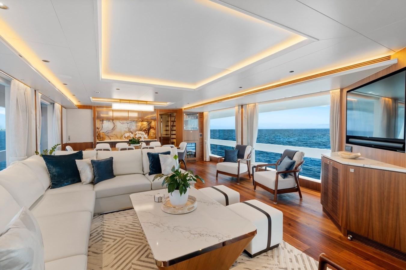 a living room with a large window aboard JEMILY II Yacht for Sale