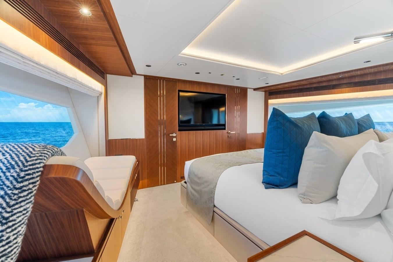 a room with a bed and a television aboard JEMILY II Yacht for Sale